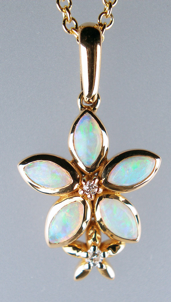 Flower shaped opal pendant with diamonds in 18ct rose gold