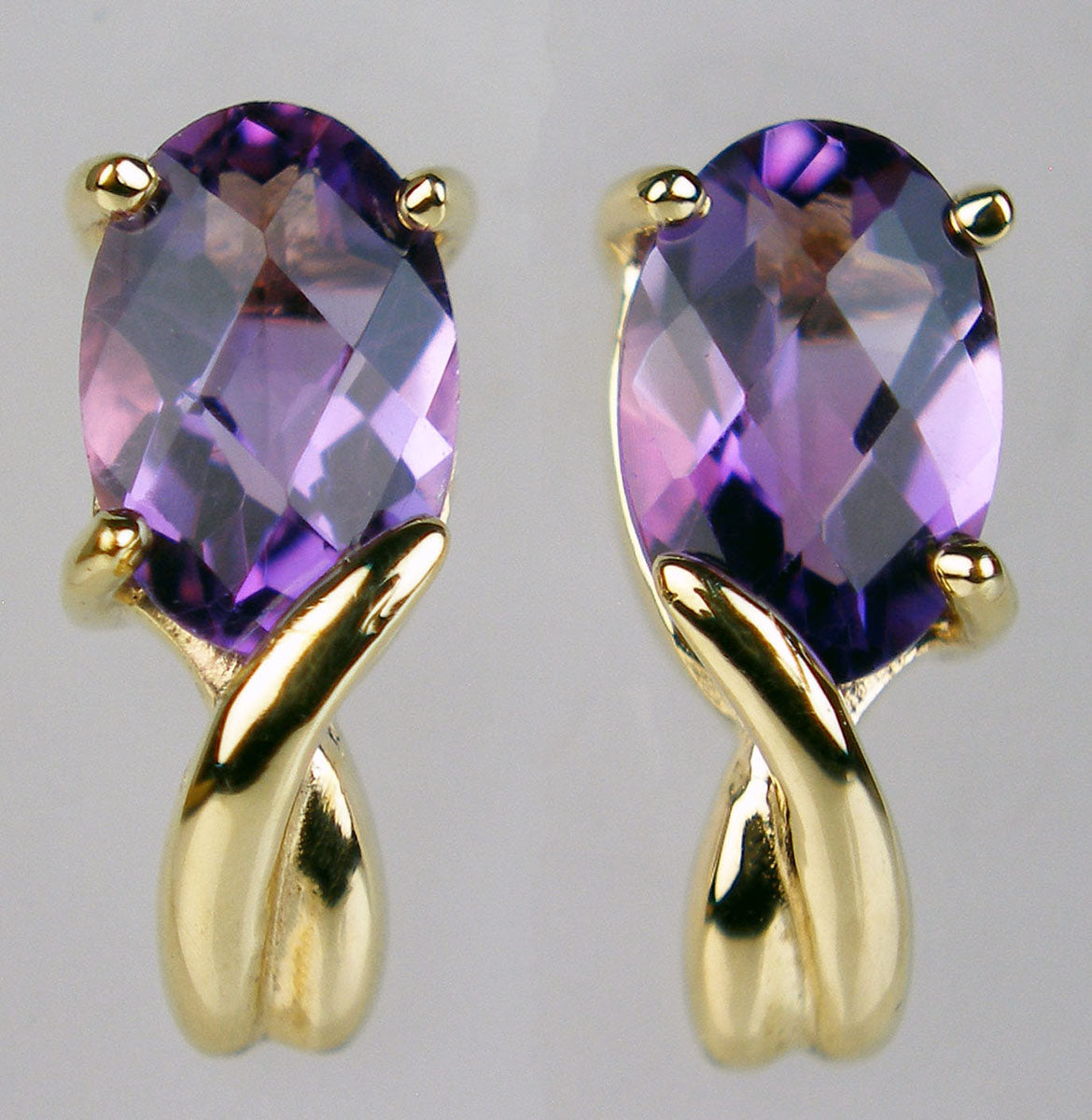 Amethyst chequerboard cut earstuds in 9ct yellow gold