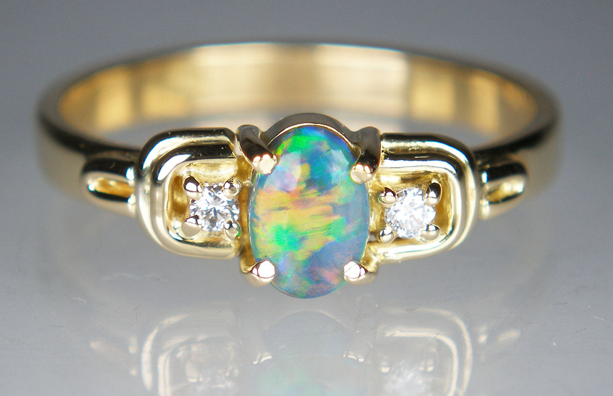 Black opal & diamond ring in 18ct yellow gold