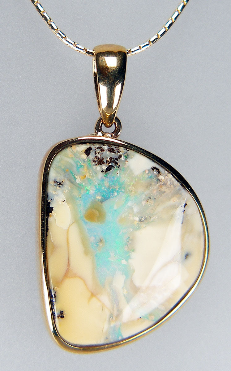 Boulder opal pendant in 9ct yellow gold