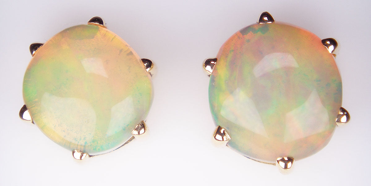 Ethiopain opal earstuds in 18ct yellow gold