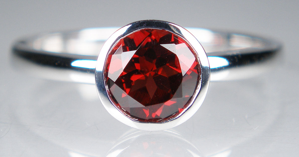 Garnet rubover ring in 9ct white gold