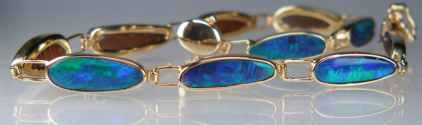 Opal doublet bracelet in 14ct yellow gold