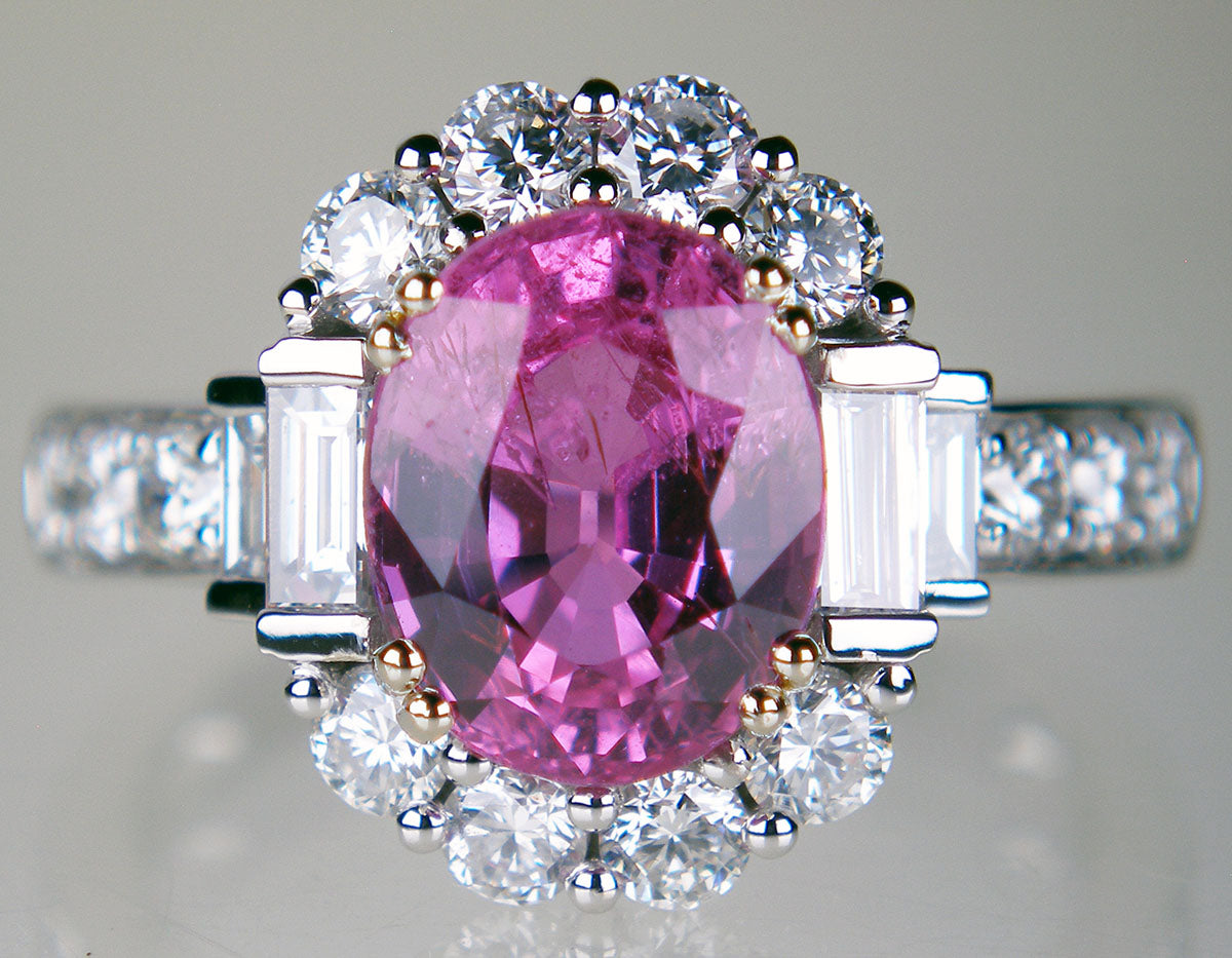 Pink sapphire oval and diamond ring in 18ct white gold