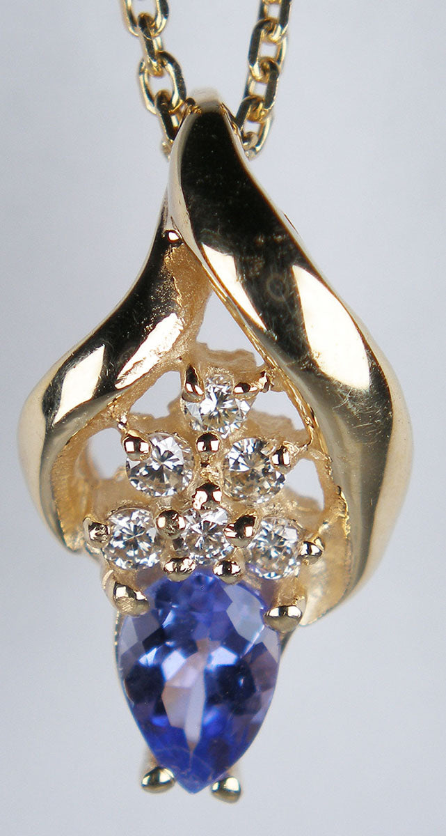 Tanzanite & diamond pendant in 14ct yellow gold