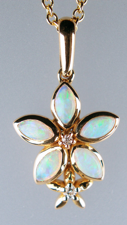 Flower shaped opal pendant with diamonds in 18ct rose gold