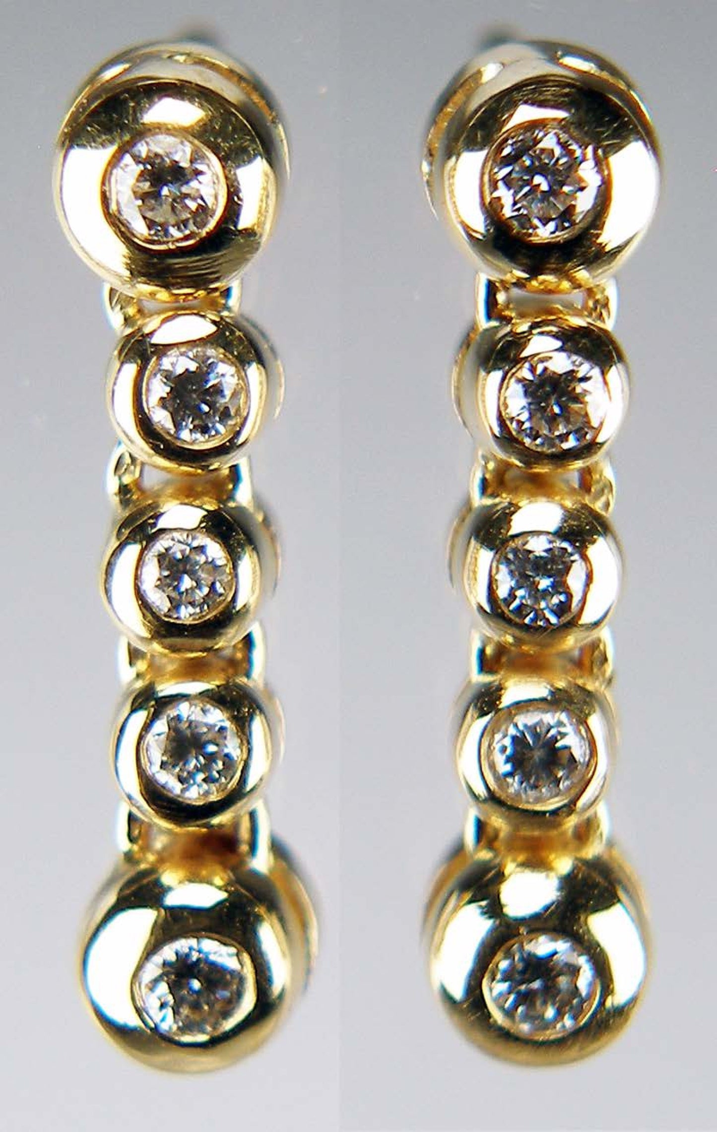 Diamond rubover drop earrings in 14ct yellow gold