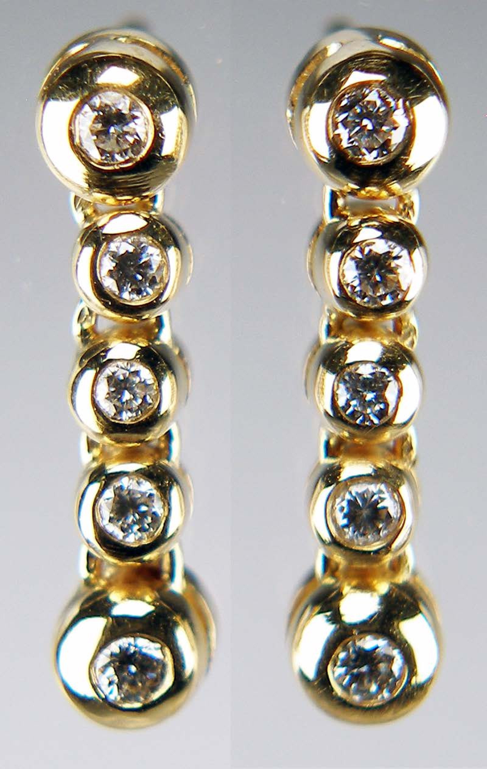 Diamond rubover drop earrings in 14ct yellow gold