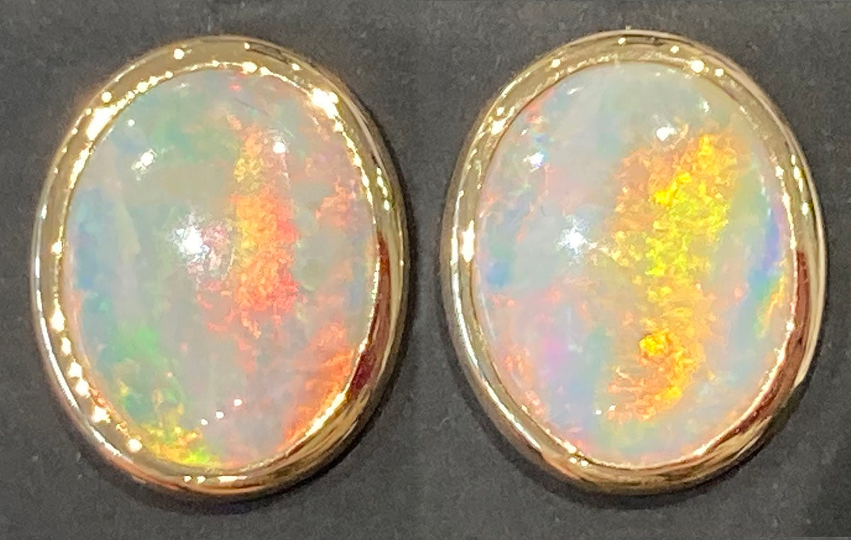 Solid opal earstuds in 18ct yellow gold
