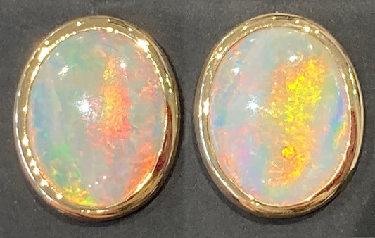 Solid opal earstuds in 18ct yellow gold