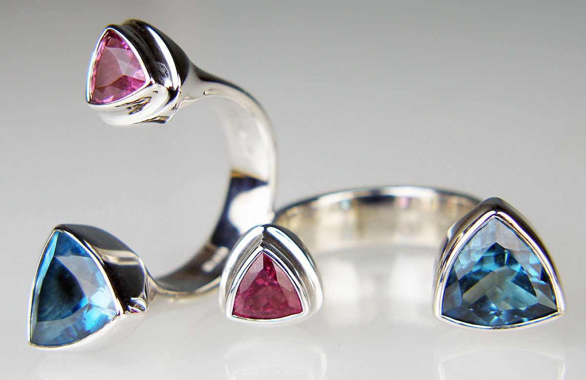 Pink tourmaline & blue topaz between finger ring in silver