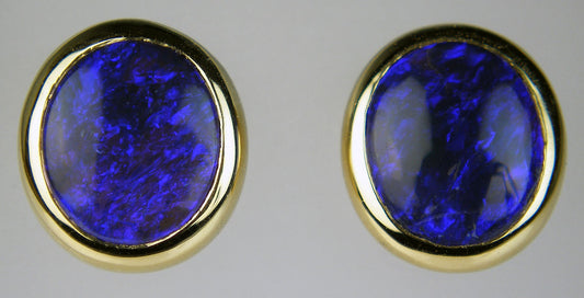 Black opal earstuds in 18ct yellow gold