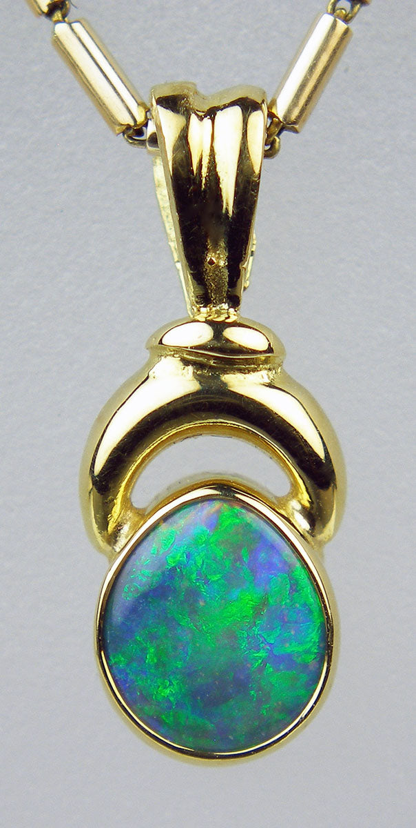 Black opal pendant in 14ct yellow gold
