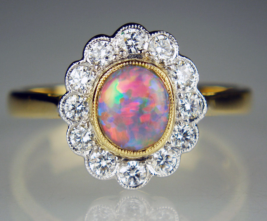 Black opal and diamond halo ring