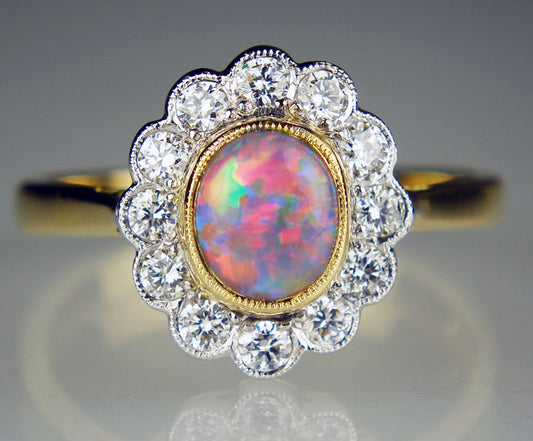 Black opal and diamond halo ring