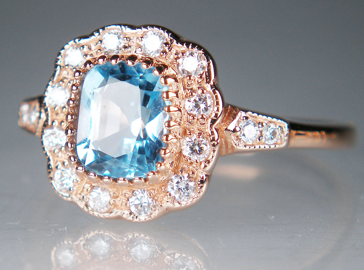 Blue topaz and diamond rng in 9ct rose gold