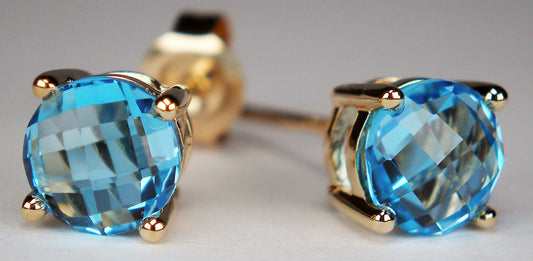 Blue topaz earstuds in yellow gold