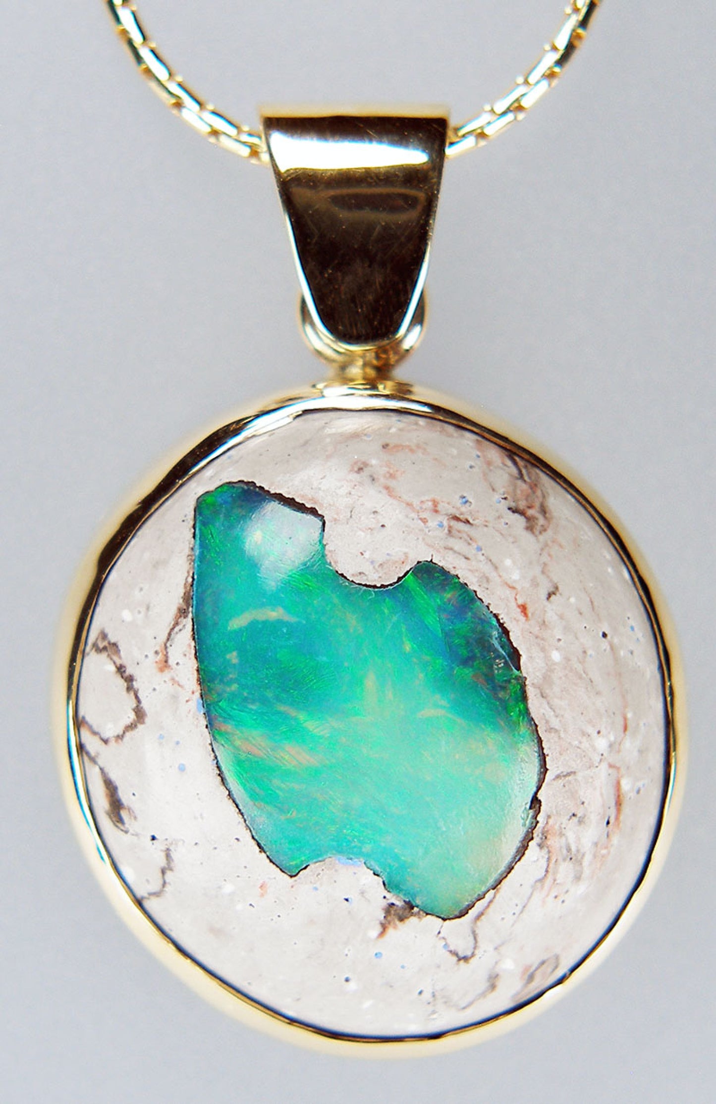 Cantera opal pendant in 9ct yellow gold