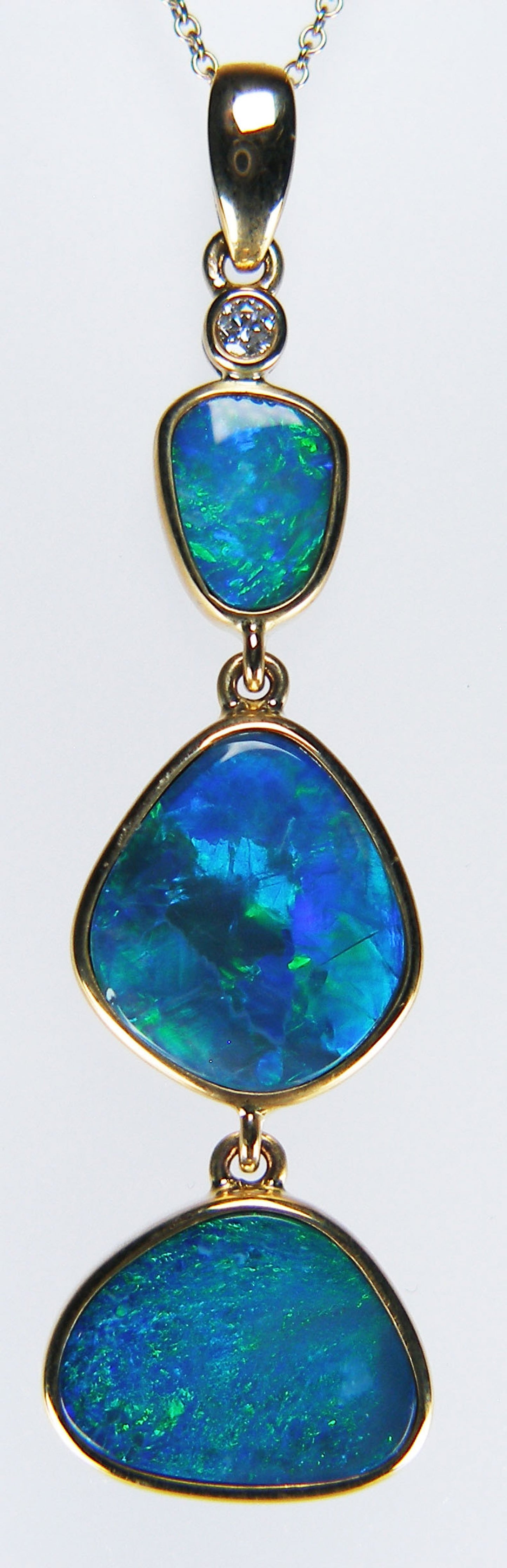 Doublet opal & diamond pendant in 9ct yellow gold