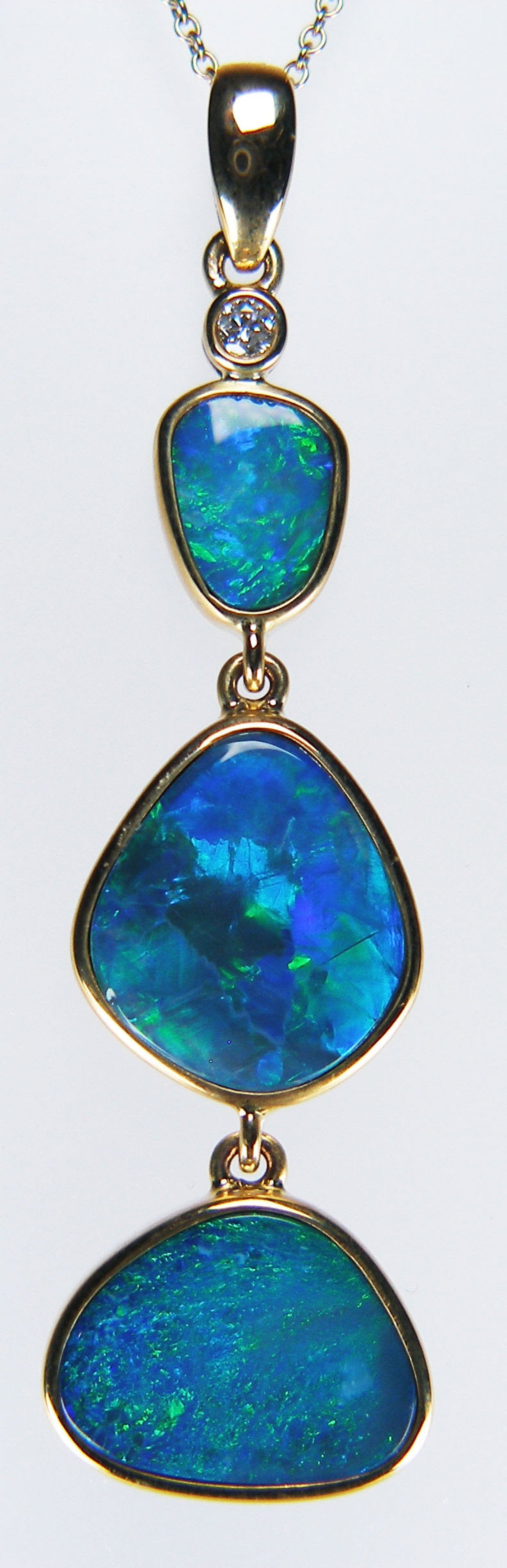 Doublet opal & diamond pendant in 9ct yellow gold