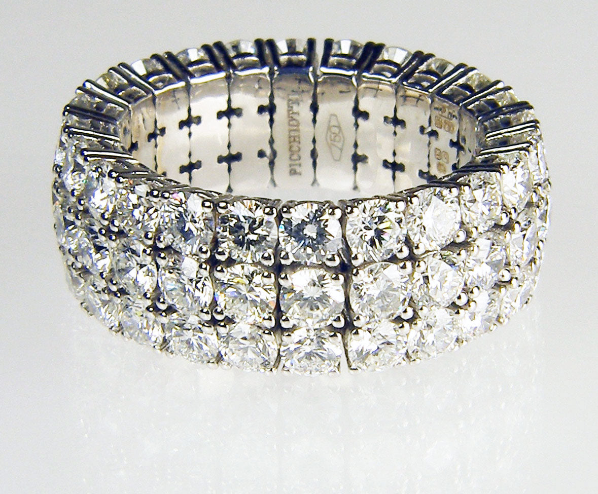 Expanding range triple row of diamond full set eternity ring