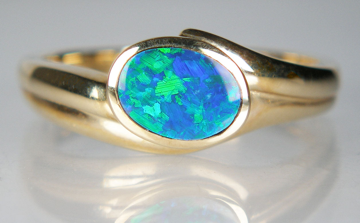 Opal doublet ring in 14ct yellow gold