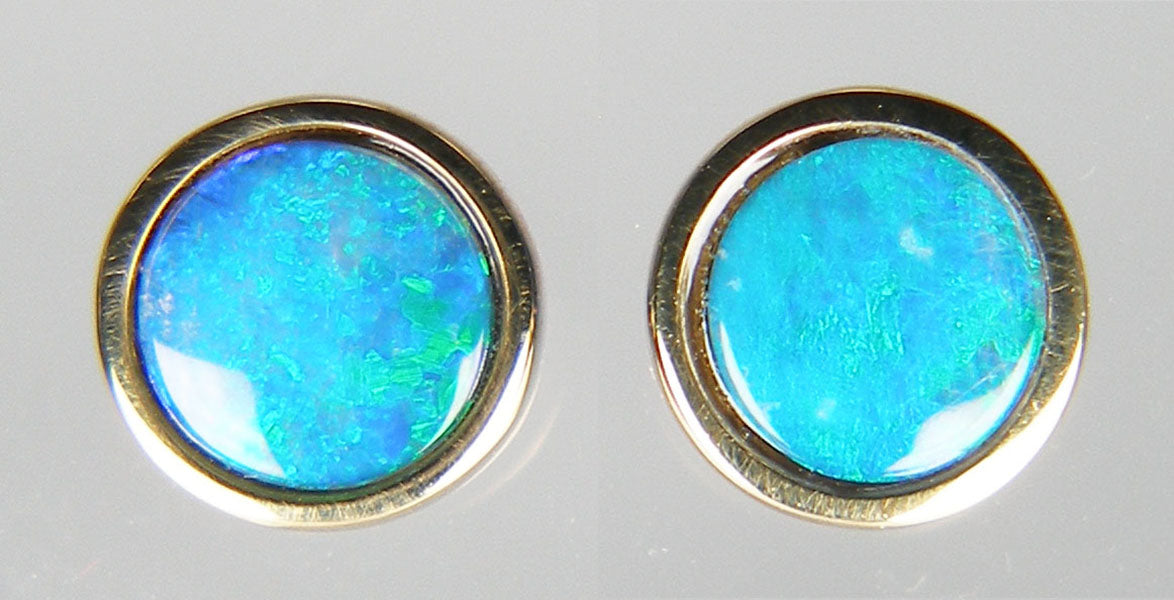 Round opal doublet earstuds in rubover 9ct yellow gold