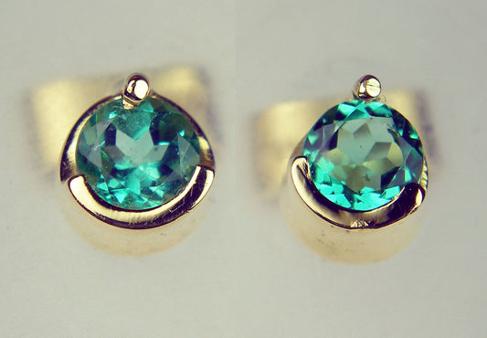 Round emerald earstuds in 14ct yellow gold