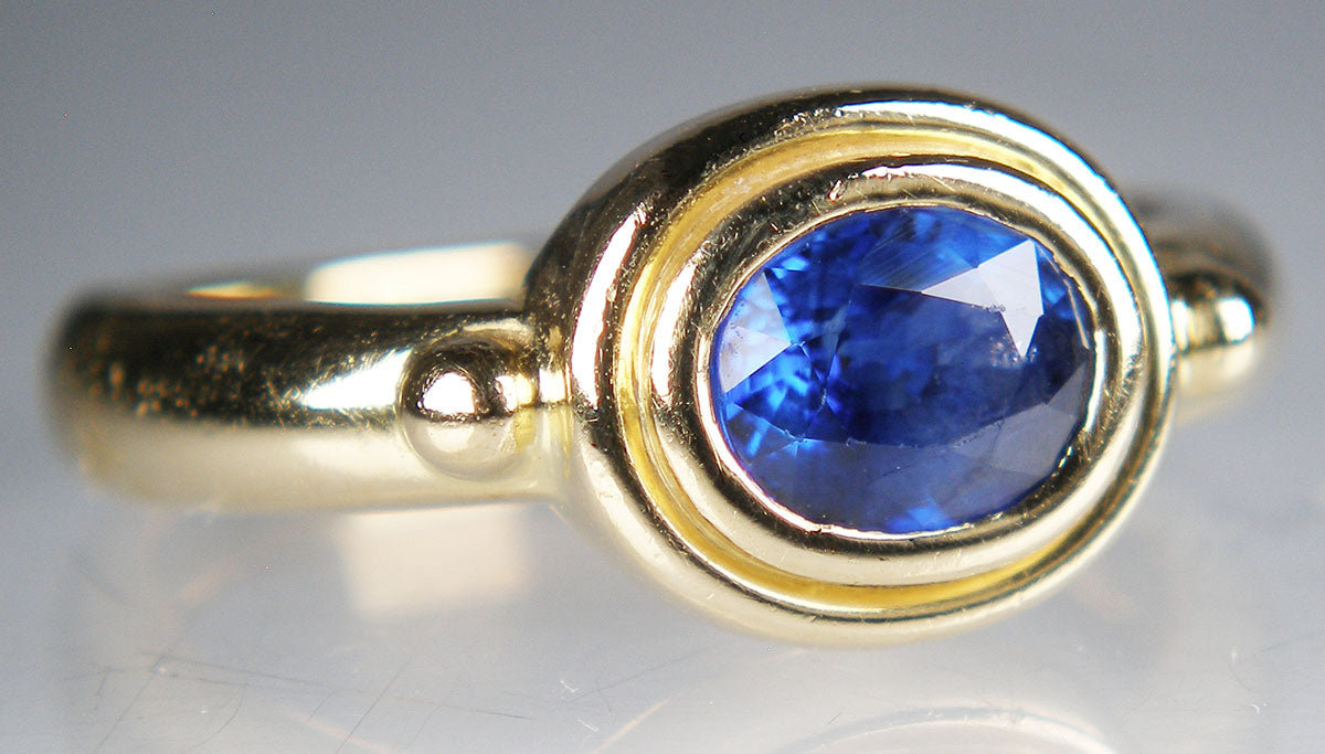 Sapphire set in Roman style 18ct yellow gold ring