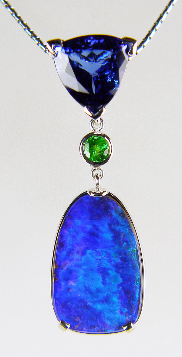 Tanzanite, tsavorite & boulder opal pendant in 18ct white gold