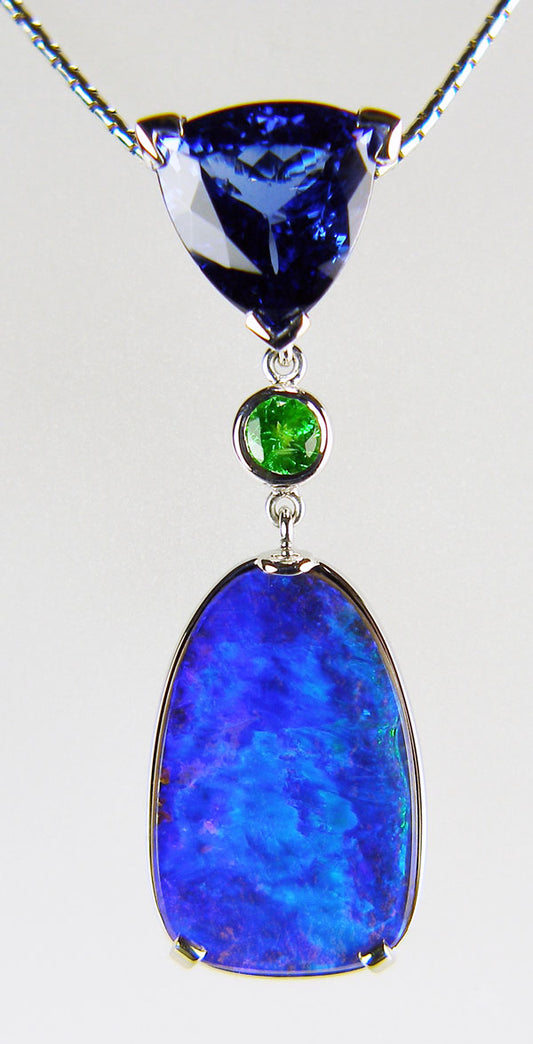 Tanzanite, tsavorite & boulder opal pendant in 18ct white gold