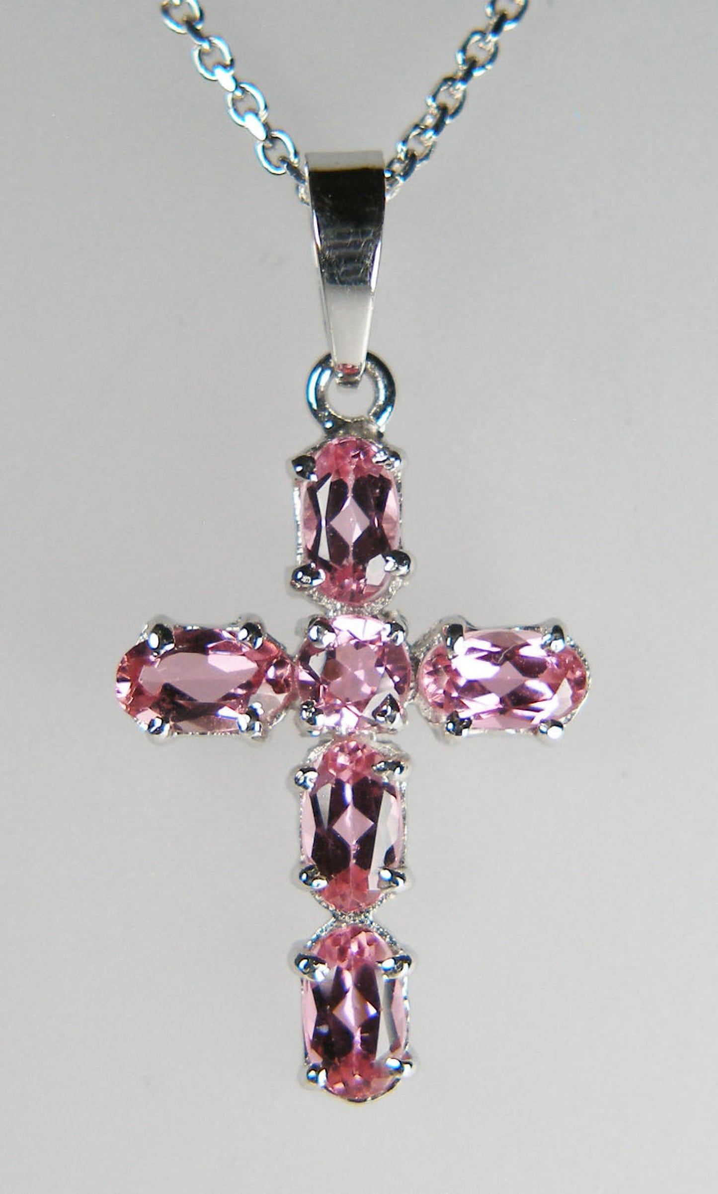 Pale pink tourmaline cross in 14ct white gold