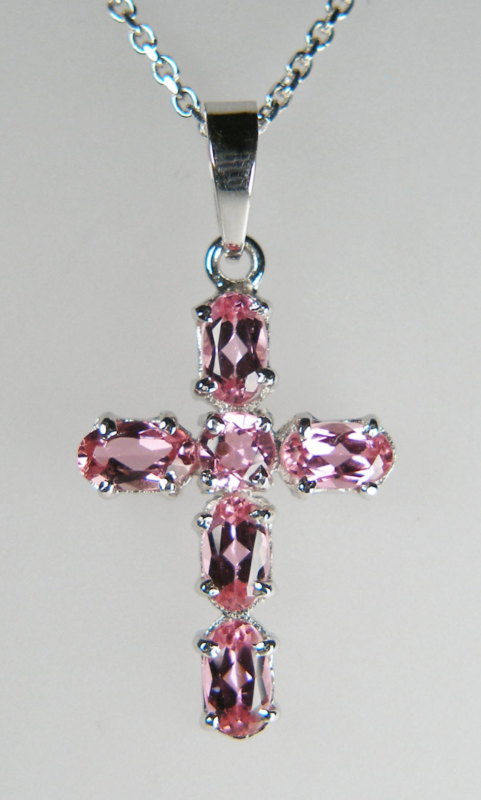 Pale pink tourmaline cross in 14ct white gold